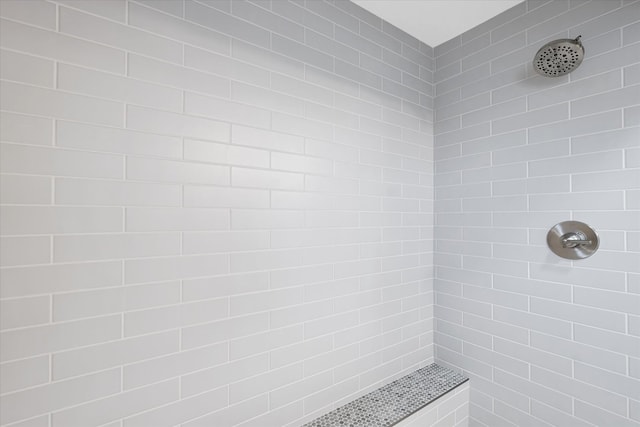 bathroom with tiled shower