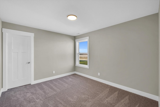 empty room featuring carpet flooring