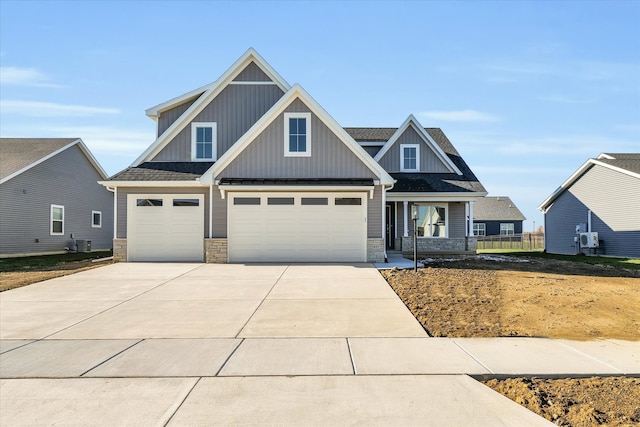 craftsman-style house with a porch and a garage