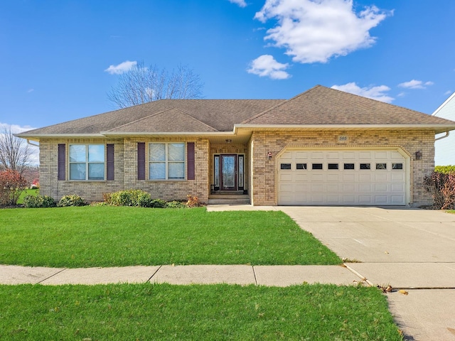 ranch-style house with a garage and a front lawn