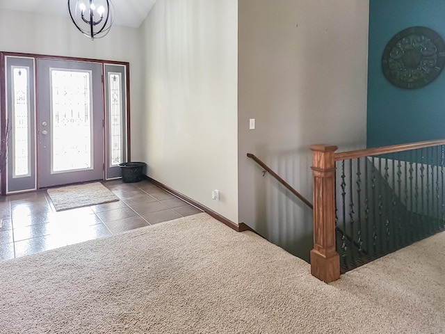 entryway featuring an inviting chandelier and tile patterned floors