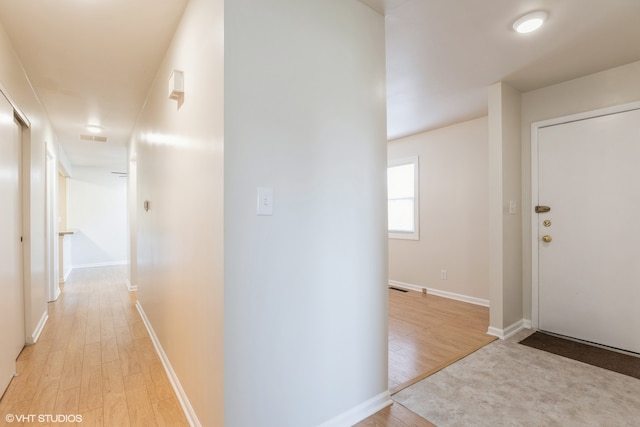 hallway featuring light hardwood / wood-style flooring