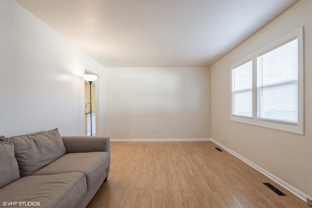 living room with light hardwood / wood-style floors