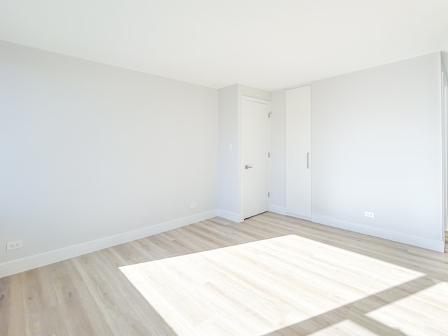 empty room with light wood-type flooring