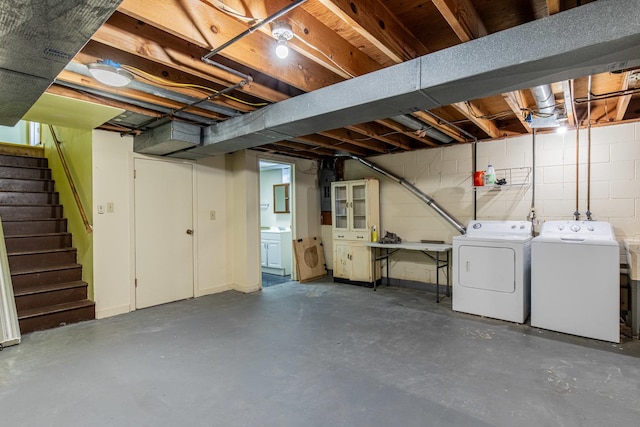 basement with washing machine and clothes dryer