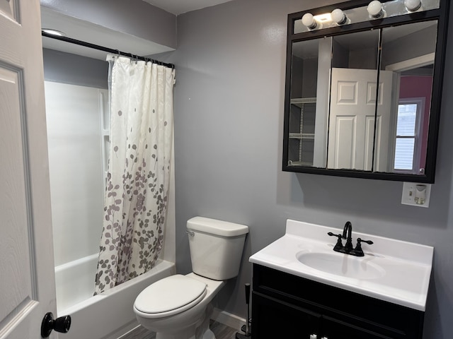 full bathroom with vanity, toilet, and shower / bath combo with shower curtain