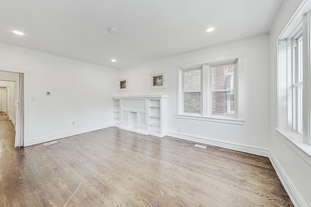 5092 W Monroe St, Chicago, IL 60644 - unfurnished living room with wood finished floors, recessed lighting, and baseboards