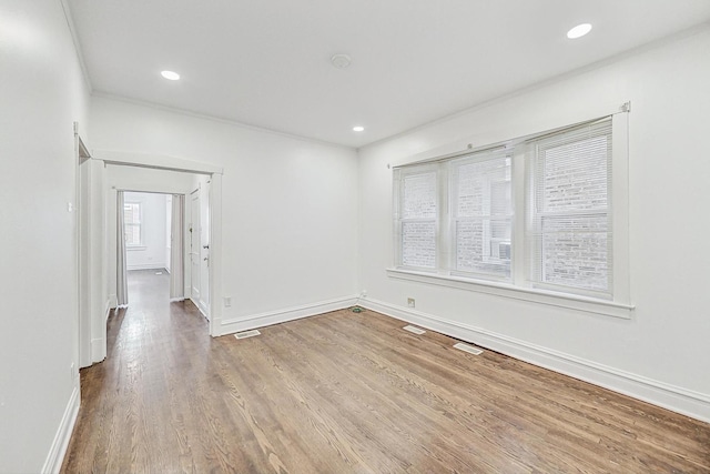 5092 W Monroe St, Chicago, IL 60644 - unfurnished room with baseboards, wood finished floors, ornamental molding, and recessed lighting