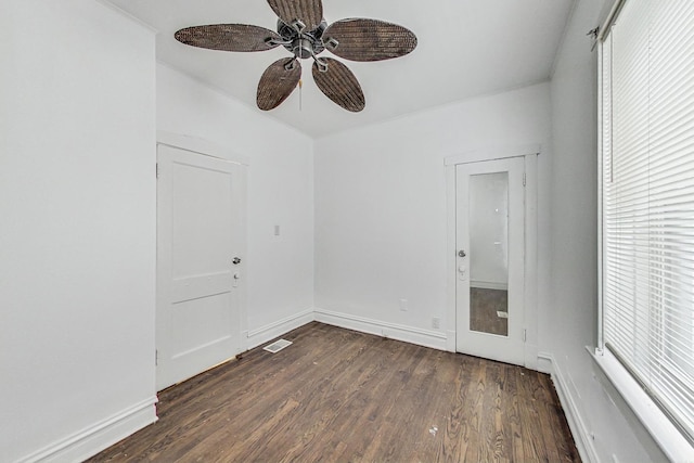 5092 W Monroe St, Chicago, IL 60644 - unfurnished room featuring a ceiling fan, dark wood-type flooring, and baseboards