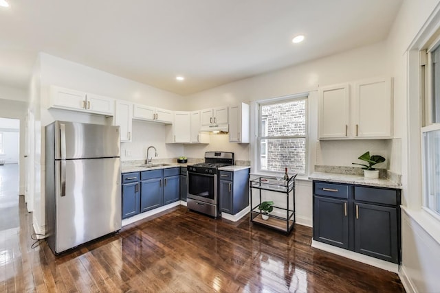 5092 W Monroe St, Chicago, IL 60644 - kitchen with stainless steel appliances, a sink, under cabinet range hood, healthy amount of natural light, and recessed lighting