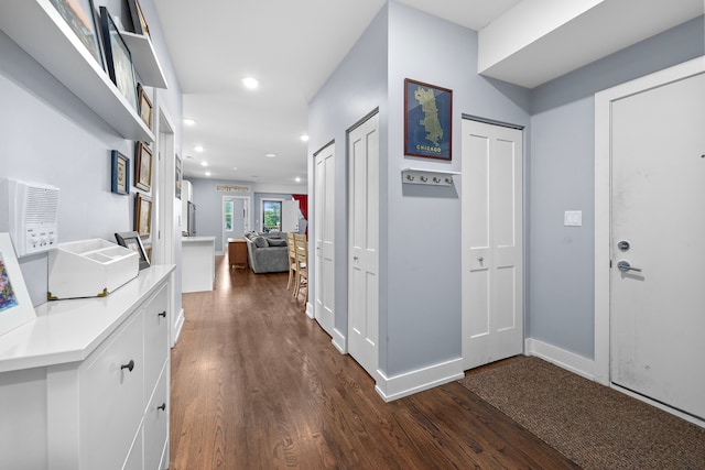 hallway with dark wood-type flooring