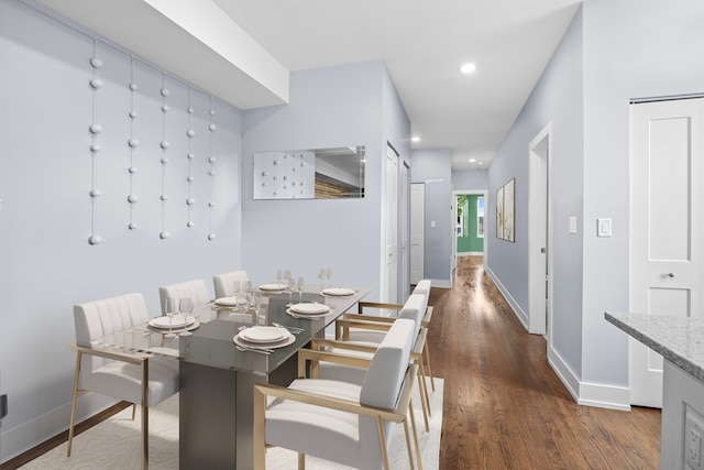 dining space featuring dark hardwood / wood-style floors