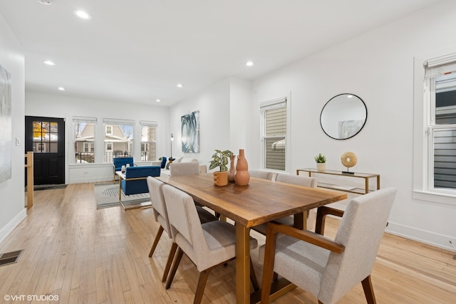 dining space with light wood-type flooring