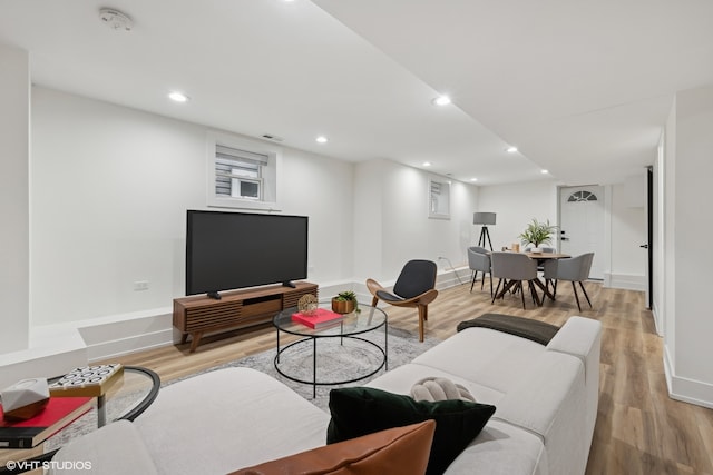 living room with light hardwood / wood-style flooring