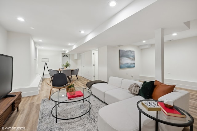 living room with light hardwood / wood-style flooring