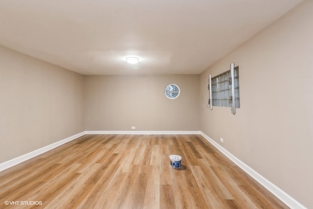 empty room with light hardwood / wood-style flooring