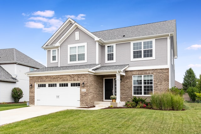 view of front of home with a garage and a front yard