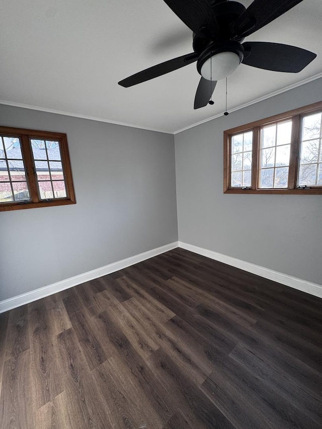 unfurnished room featuring ceiling fan, crown molding, and dark wood-type flooring