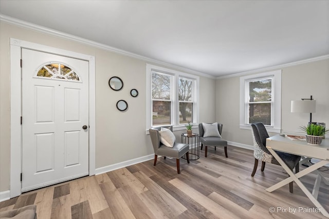 office area featuring light wood-type flooring and ornamental molding