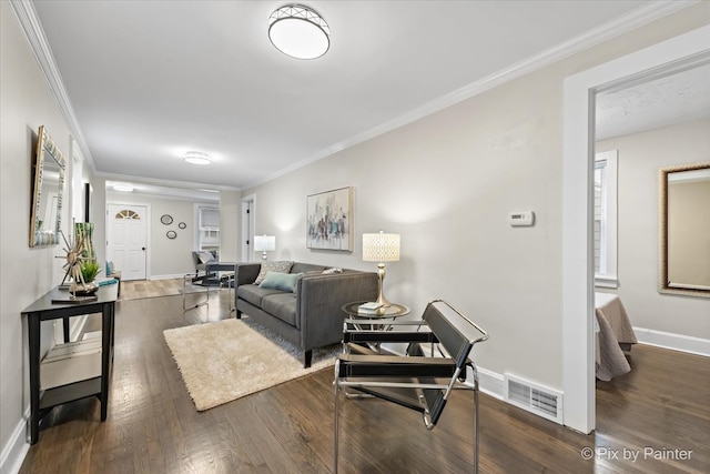 living room with dark hardwood / wood-style floors and ornamental molding