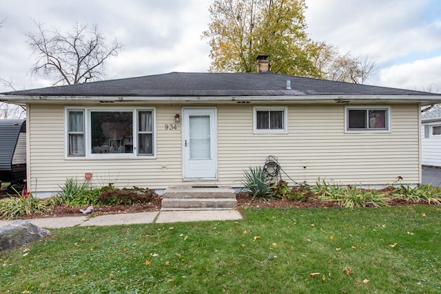 view of front of home with a front lawn