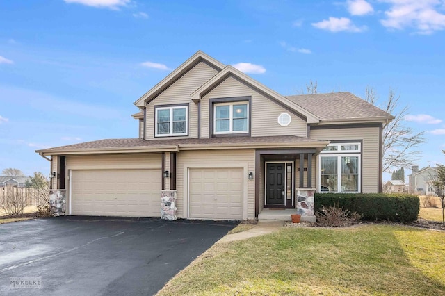 view of front of house featuring a garage and a front yard