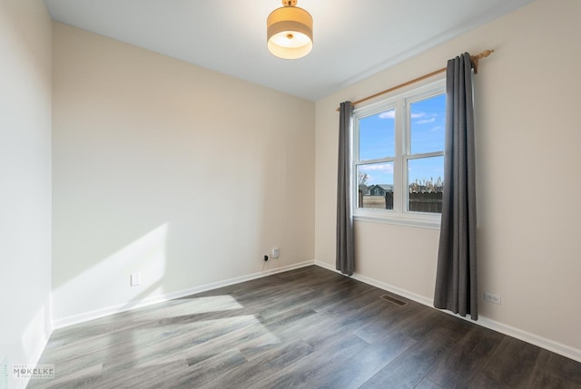 spare room featuring hardwood / wood-style flooring