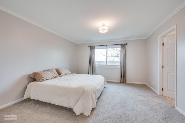 carpeted bedroom with ornamental molding