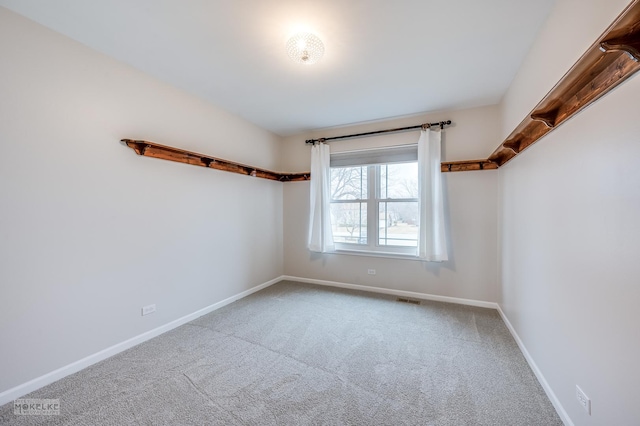 empty room featuring carpet flooring