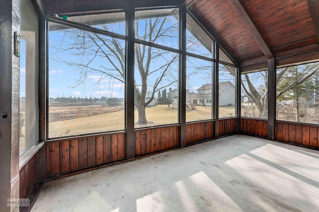 unfurnished sunroom with vaulted ceiling and a healthy amount of sunlight