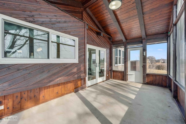 unfurnished sunroom with french doors, wooden ceiling, and vaulted ceiling with beams