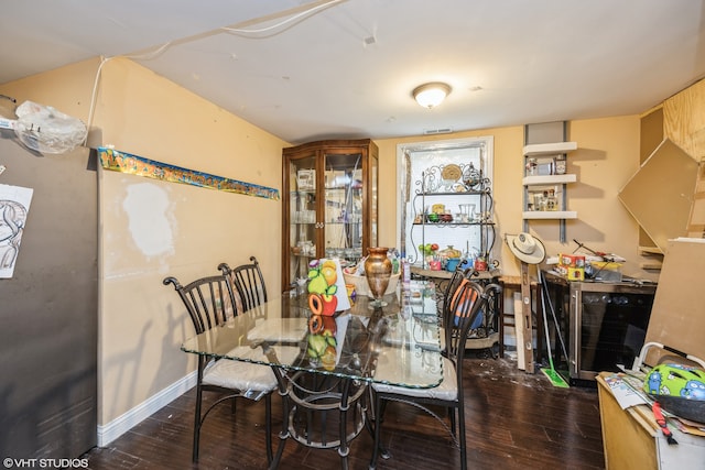 dining room with dark hardwood / wood-style flooring