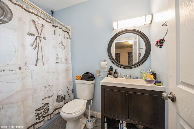 bathroom with tile patterned flooring, vanity, toilet, and a shower with shower curtain