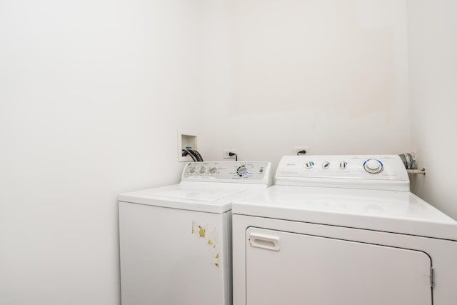 washroom featuring washer and dryer