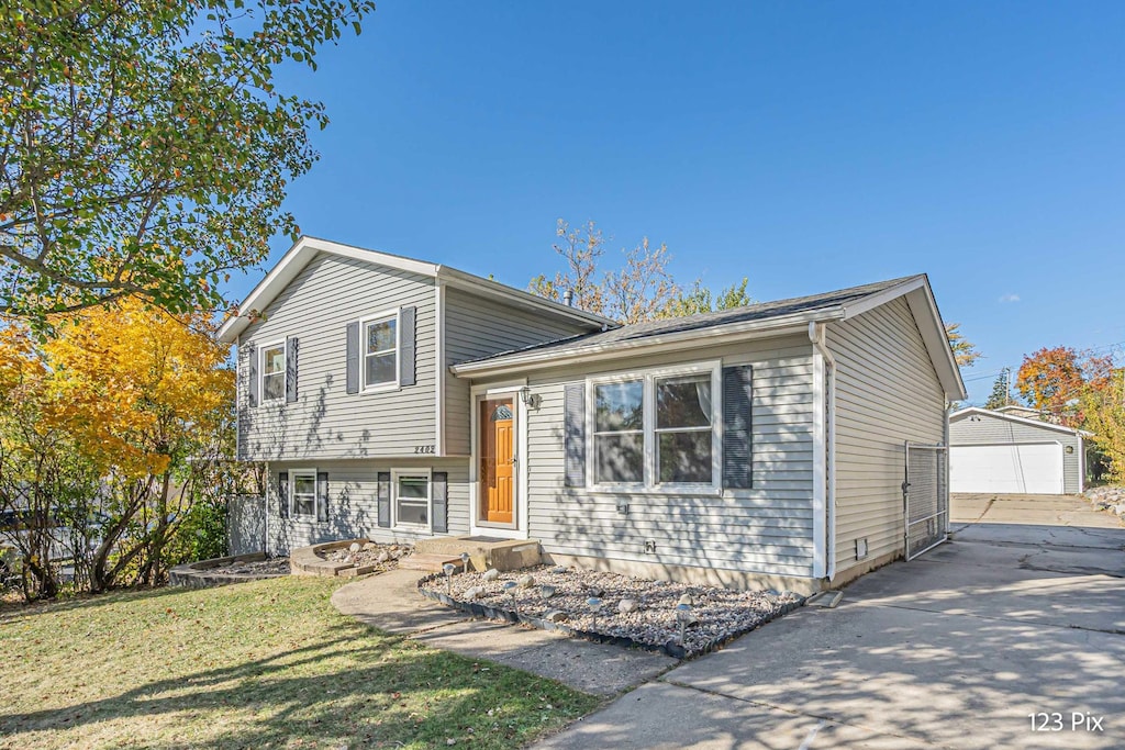 split level home with an outbuilding and a garage