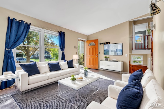 living room featuring vaulted ceiling