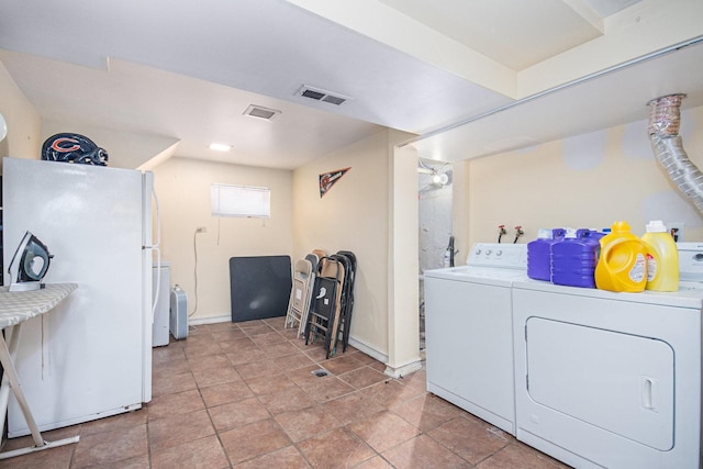 washroom with washer and clothes dryer