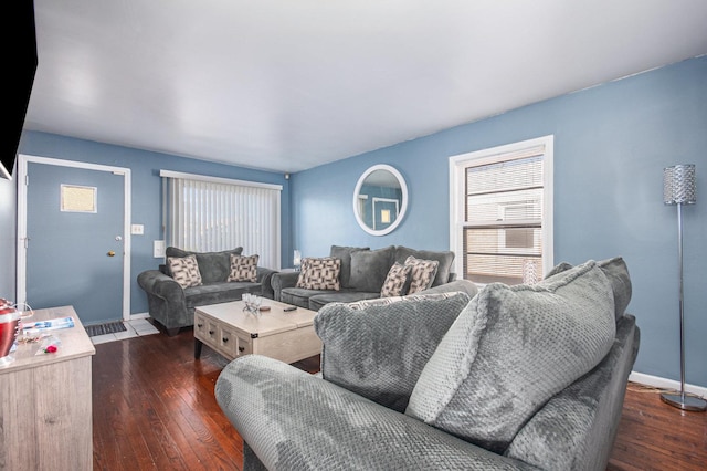 living room featuring dark wood-type flooring