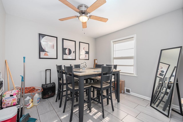 dining room with ceiling fan