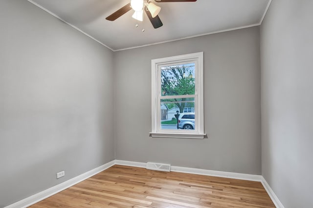 empty room with ceiling fan, visible vents, baseboards, and light wood-style floors