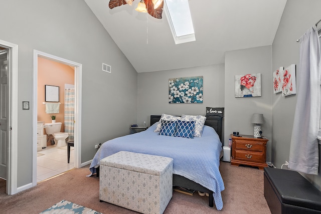 bedroom with carpet flooring, connected bathroom, a skylight, and ceiling fan