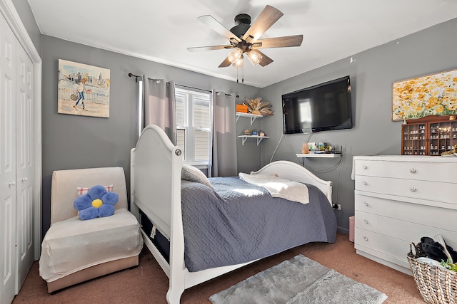 carpeted bedroom with a closet and ceiling fan