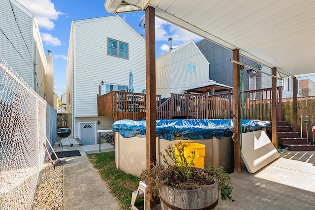 exterior space with a covered pool