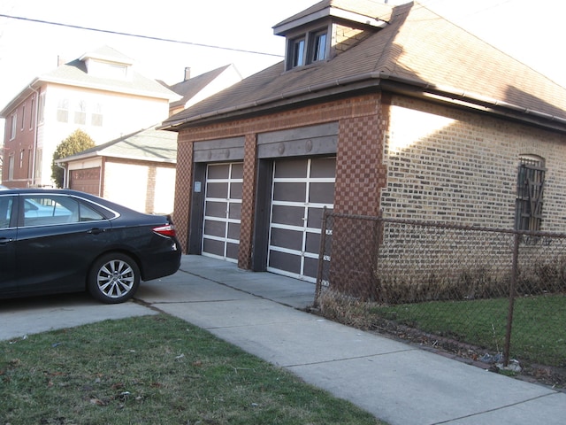 view of side of property featuring a garage