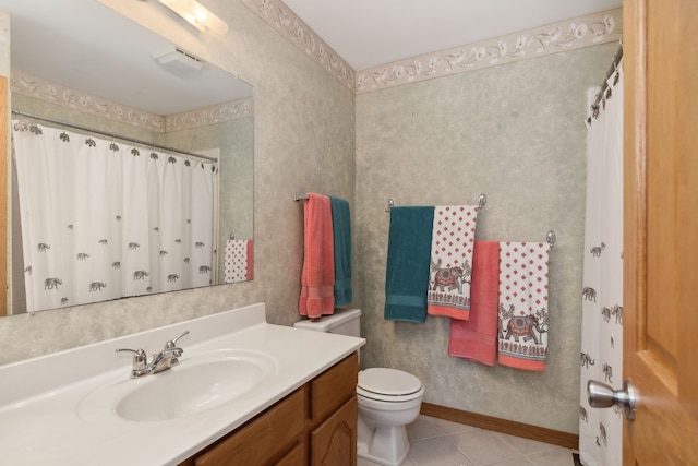 bathroom featuring toilet, vanity, tile patterned floors, and a shower with shower curtain