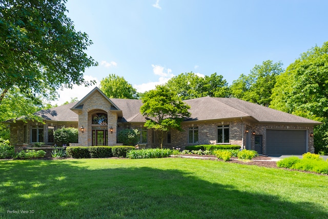 view of front facade featuring a garage and a front lawn