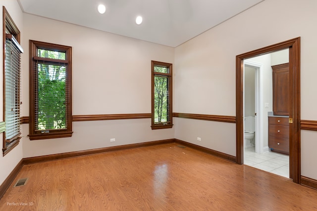 unfurnished room featuring light hardwood / wood-style floors