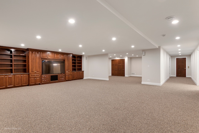 unfurnished living room featuring light carpet