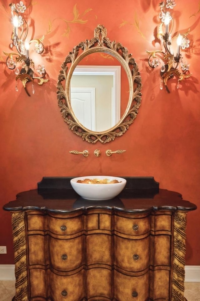 bathroom featuring vanity and baseboards