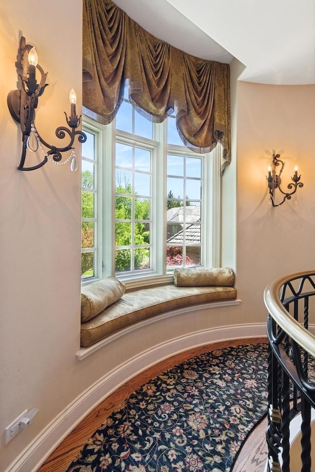 room details with baseboards and wood finished floors